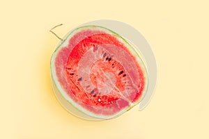Watermelon fruit sliced half isolated on yellow background