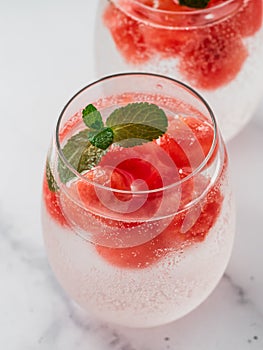 Watermelon ice with sparkling water in glasses