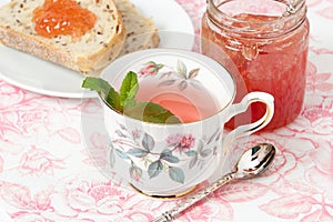 Watermelon Jam, Herbal Tea, Marshmallows. White Wooden Table.