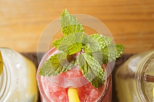 Watermelon juice and lemon juices in glass with mint leaves
