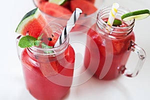 Watermelon juice and slices with lime