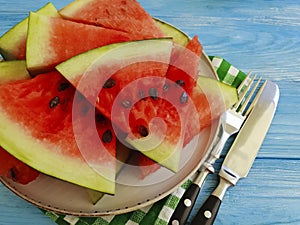 Watermelon pieces seasonal nutrition on a blue wooden background organic