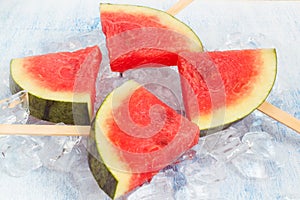 Watermelon popsicle in ice cubes
