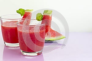 Watermelon pulp smoothie. Delicious red sliced watermelon on a plate. Stock of fiber and fructose. Summer food concept