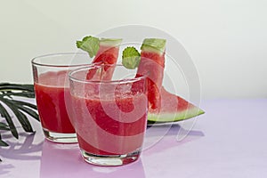 Watermelon pulp smoothie. Delicious red sliced watermelon on a plate. Stock of fiber and fructose. Summer food concept