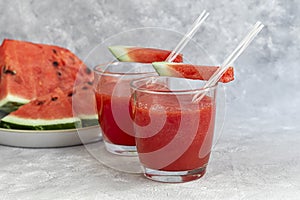 Watermelon pulp smoothie. Delicious red sliced watermelon on a plate. Stock of fiber and fructose. Summer food concept