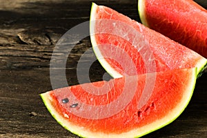 the watermelon on a rustic wooden table background