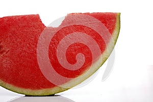 Watermelon slice with a bite