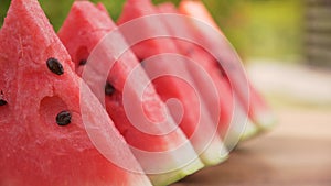 Watermelon slices in a row on the table