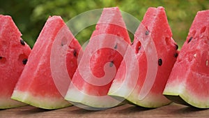 Watermelon slices in a row on the table - close up