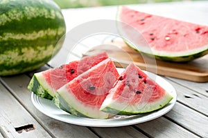 Watermelon slices on the wooden table photo