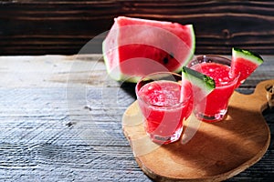 Watermelon smoothie in glass on wood table. summer refreshment
