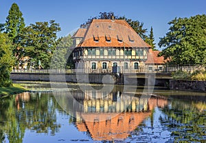 Watermill building with reflection in the water in Steinfurt