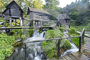 Watermill hut over cascading stream of Pliva Lake in Jajce Bosnia and Herzegovina.