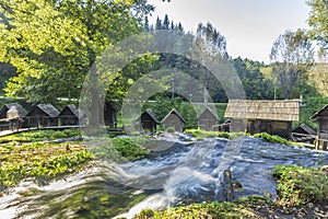 Watermill hut over cascading stream of Pliva Lake in Jajce Bosnia and Herzegovina.