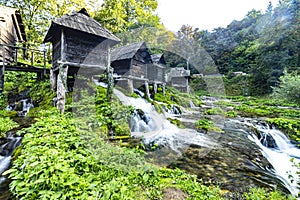 Watermill hut over cascading stream of Pliva Lake in Jajce Bosnia and Herzegovina.