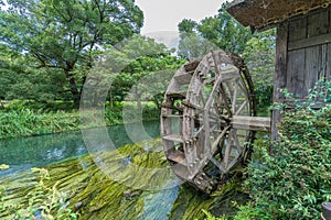 Watermill by Sai river Sai-Gawa near Daio Wasabi Farm in Azumino, Nagano Prefecture, Japan