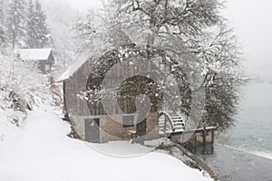 Watermill and snowy river
