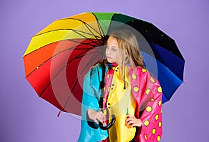 Waterproof accessories for children. Waterproof accessories make rainy day cheerful and pleasant. Kid girl happy hold