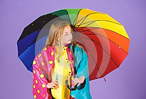 Waterproof accessories for children. Waterproof accessories make rainy day cheerful and pleasant. Kid girl happy hold