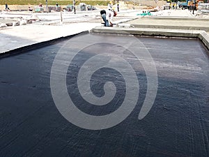 Waterproof coatings applied on flat roof concrete surfaces. photo