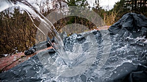 Waterproof jacket with pouring water.