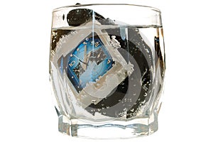 Waterproof watch in glass with water.