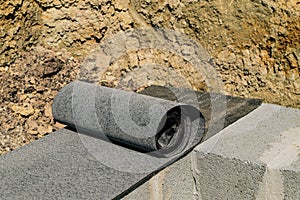 Waterproofing the base of a house under construction