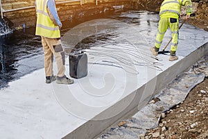 Waterproofing coating. Builder applying waterproofing bitumen mastic on concrete