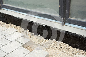 Waterproofing house foundation with spray on tar