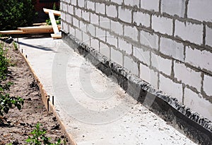 Waterproofing and insulation house foundation wall. Foundation Waterproofing and Damp proofing Coatings. photo