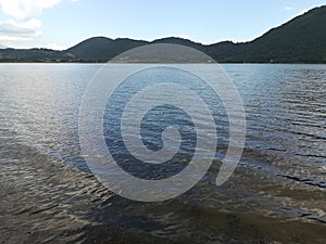 The waters of a lake near a mountain