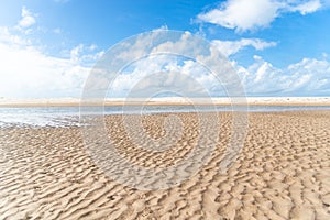 Waters from a river that flows into the sea. white sand on the beach. Preserved environment