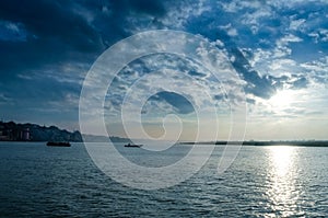 waterscape landscape boats sailing in river dramatic sky