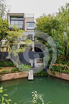 Waterside house in cloudy winter afternoon