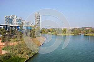 Waterside modern buildings in blue sky at sunny winter noon