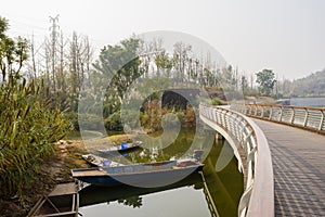 Waterside sanitation boasts under footbridge in sunny winter aft