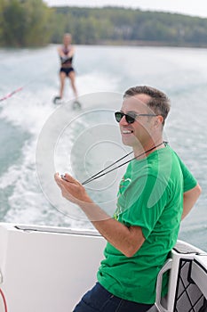 Waterski coach with stopwatch