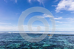 Watersport kayak in clear pacific ocean water in the reef on a tropical island