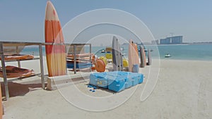 Watersports equipment on display on a beach