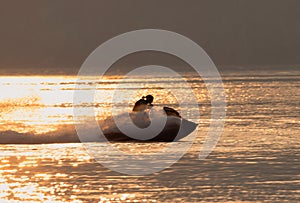 Watersports on lake Garda at sunset