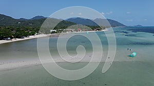 Watersports With Tourists During Summer Holiday In Ko Pha Ngan, Southeast Thailand. Aerial Wide Shot