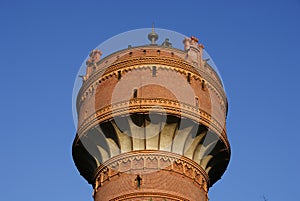 Watertower under blue sky photo