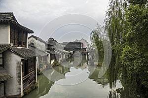 Watertown. Channel with buildings on water. Zhouzhuang photo