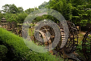 Waterwheel front of entrance to Huanglong cave in China.