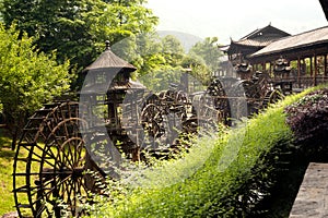 Waterwheel front of entrance to Huanglong cave in China.