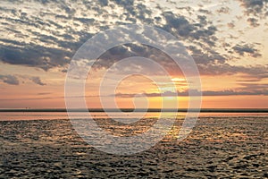 Wattenmeer, mud tideland in North Sea, Germany. Nordsee, Watt by sunset.