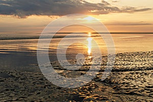 Wattenmeer, mud tideland in North Sea, Germany. Nordsee, Watt by sunset.