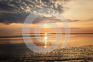 Wattenmeer, mud tideland in North Sea, Germany. Nordsee, Watt by sunset.