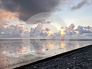 Wattenmeer, mud tideland in North Sea, Germany on sunset. Nordsee, Watt.